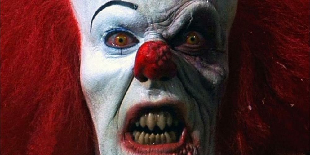 close up shot of Pennywise in the middle of it’s battle with the Losers Club