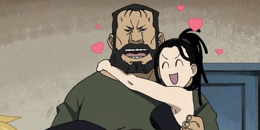 Sig carrying Izumi in his arms in Fullmetal Alchemist