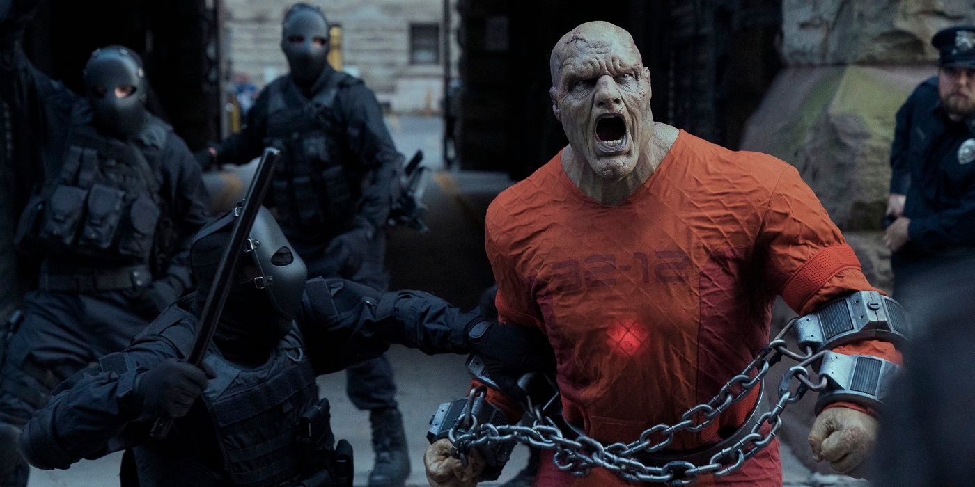 Blackstar screams while wrapped in chains as solider look on in the Netflix show Jupiter's Legacy.