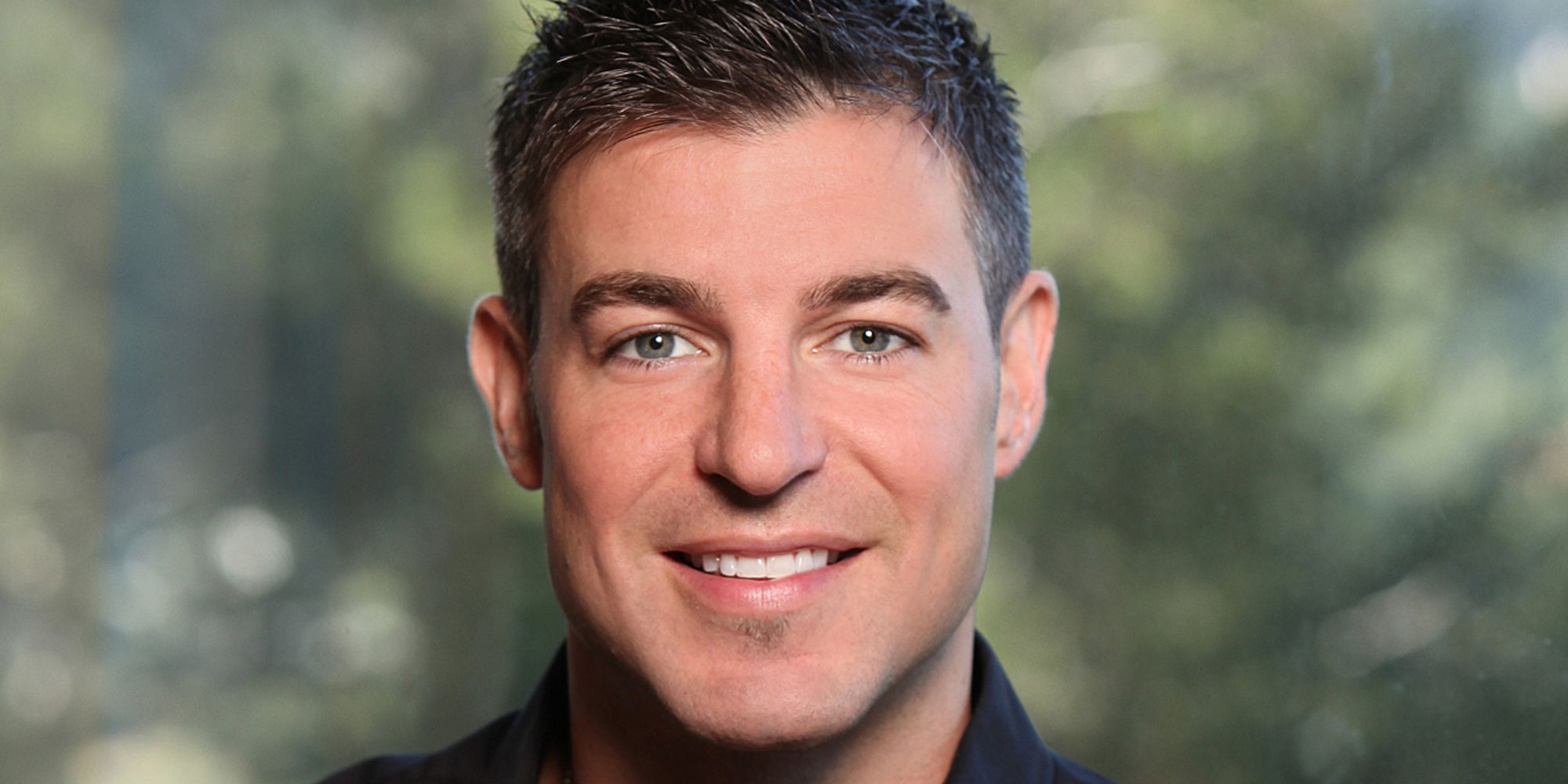 Jeff Schroeder smiling for a promo image for Big Brother 13.