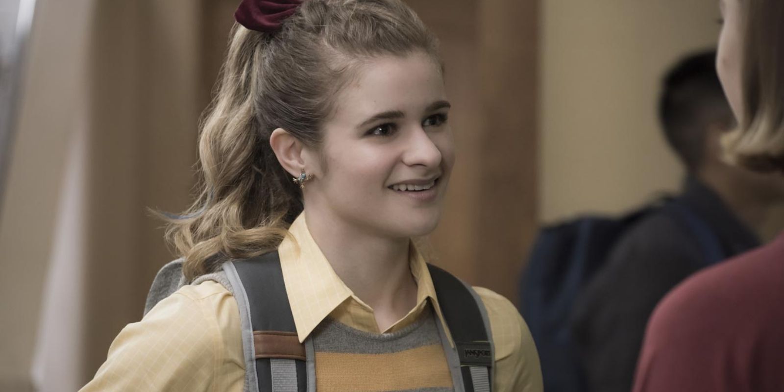 Paige Hardaway smiles at Sam in their high school hallway in Atypical