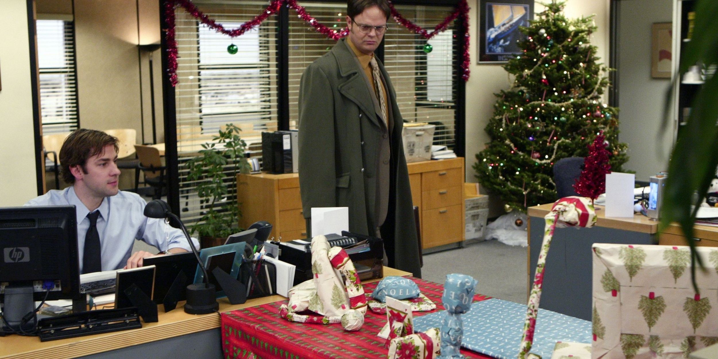 Jim gift wrapping Dwight's desk in The Office