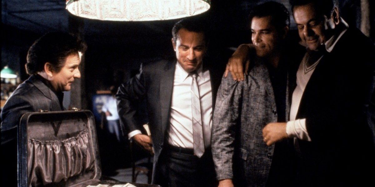 Henry Hill counts cash from a heist