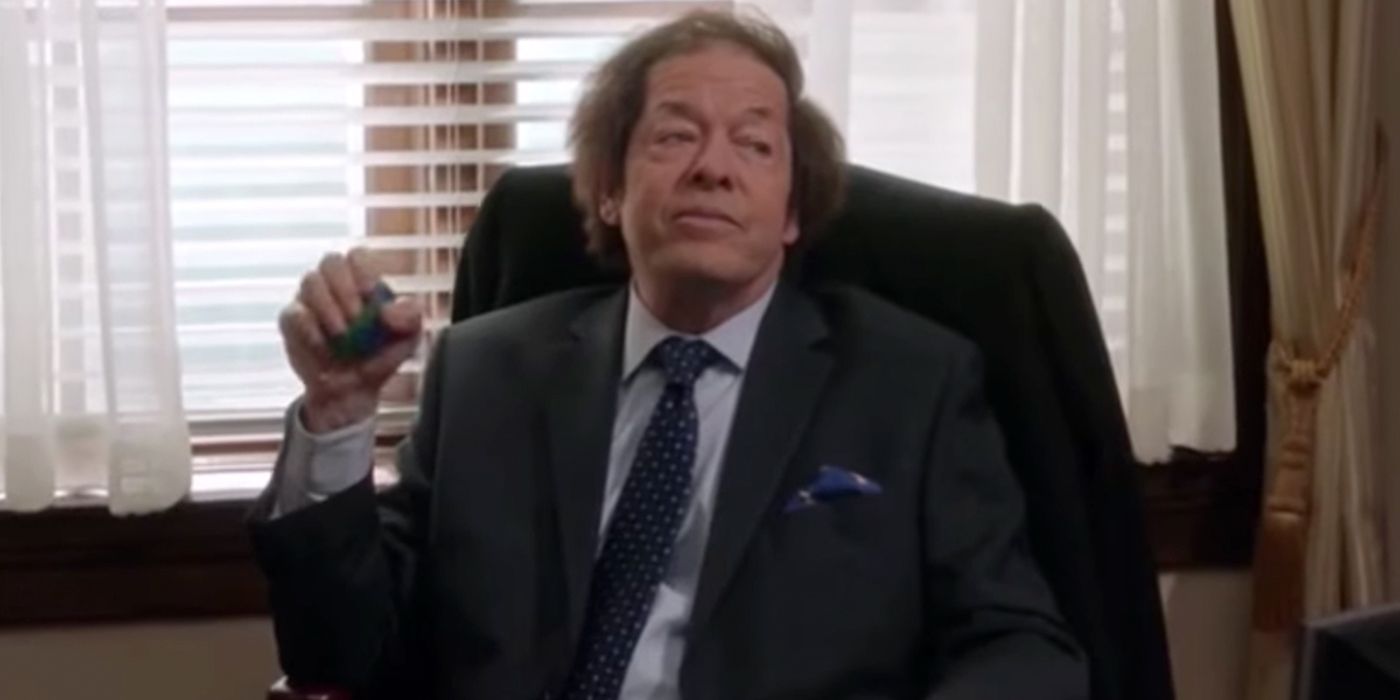 Jonathan Hadary sitting at a desk in Veep.