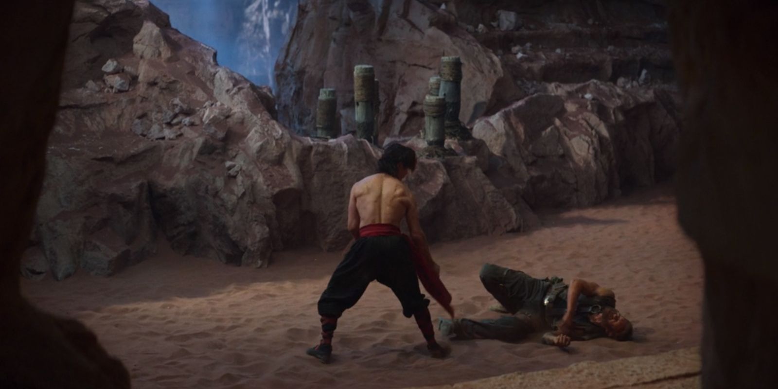 Kano knocked down by Liu Kang in Mortal Kombat 2021