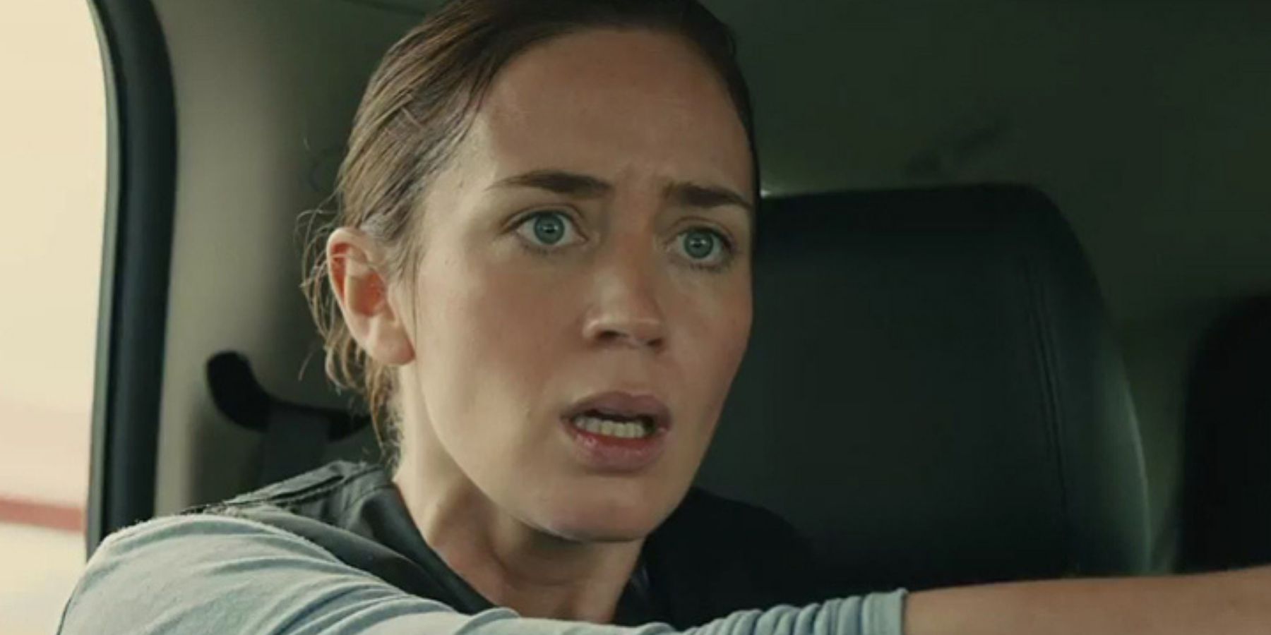 A shocked Kate Mercer looks at something from inside a car