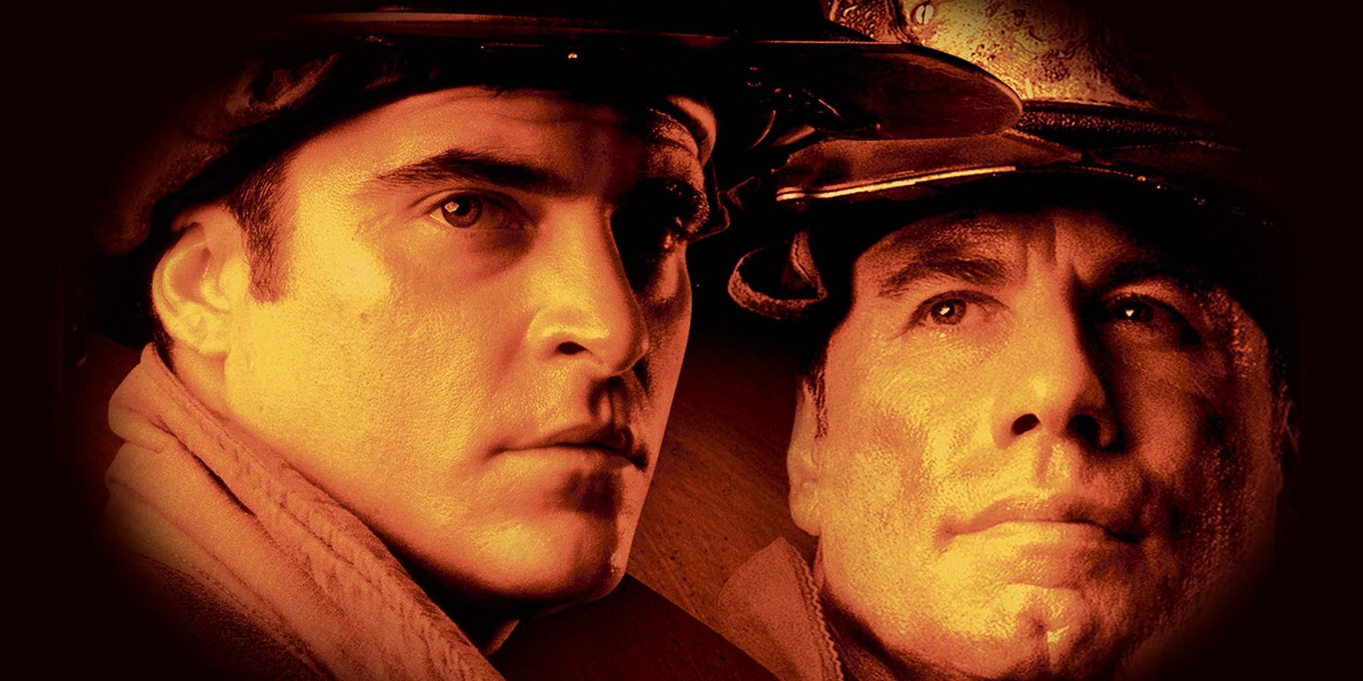 Joaquin Phoenix and John Travolta as firefighters looking off camera in Ladder 49 poster