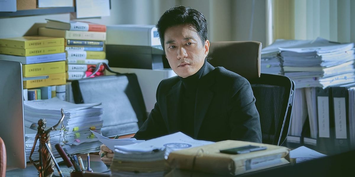Jong-Hoon in his legal office with paperwork in Law School