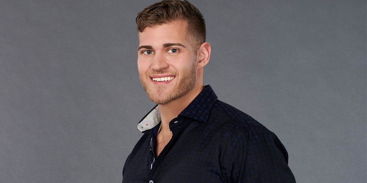 Luke Parker smiles and poses for a promotional photo of The Bachelorette