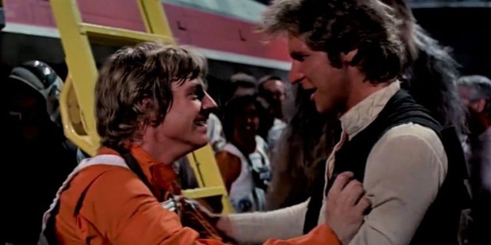 Luke Skywalker and Han Solo celebrate destroying the death Star in A New Hope