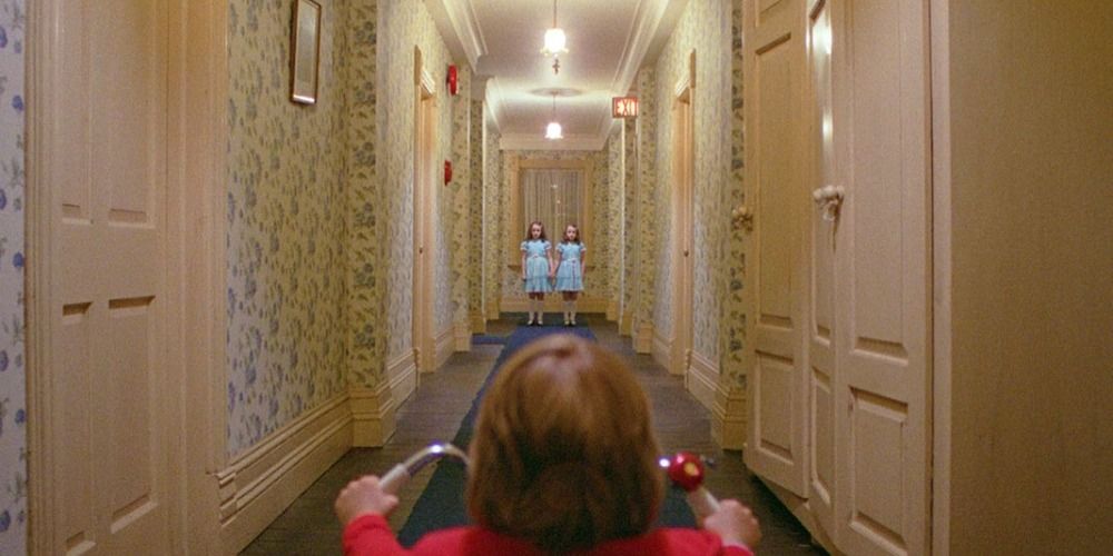 Danny riding his trike down the hallway in The Shining.