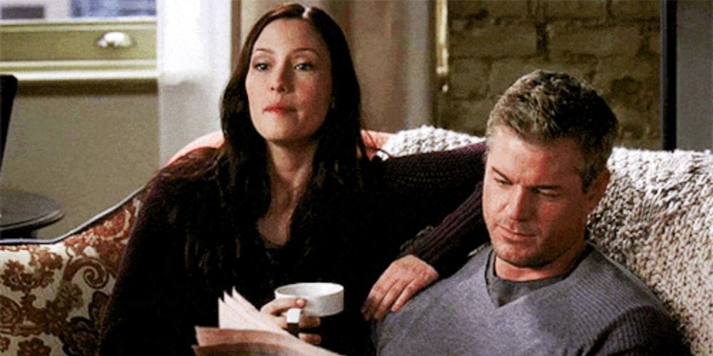 Mark and Lexie sitting on the couch on Grey's Anatomy