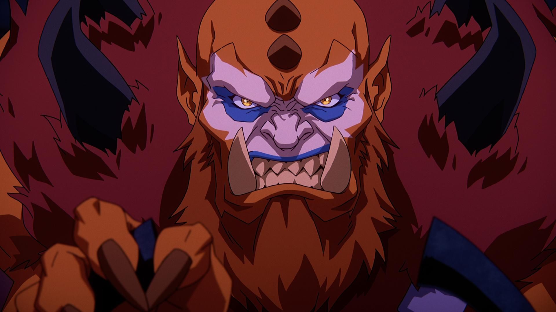 In a CG animated close-up still from Masters of the Universe: Revelation, Beast Man, a large male figure with pointed ears, maroon fur, a long red beard, pink and blue face paint and horns on his head and back. He looks straight ahead and bares his teeth in a growl.