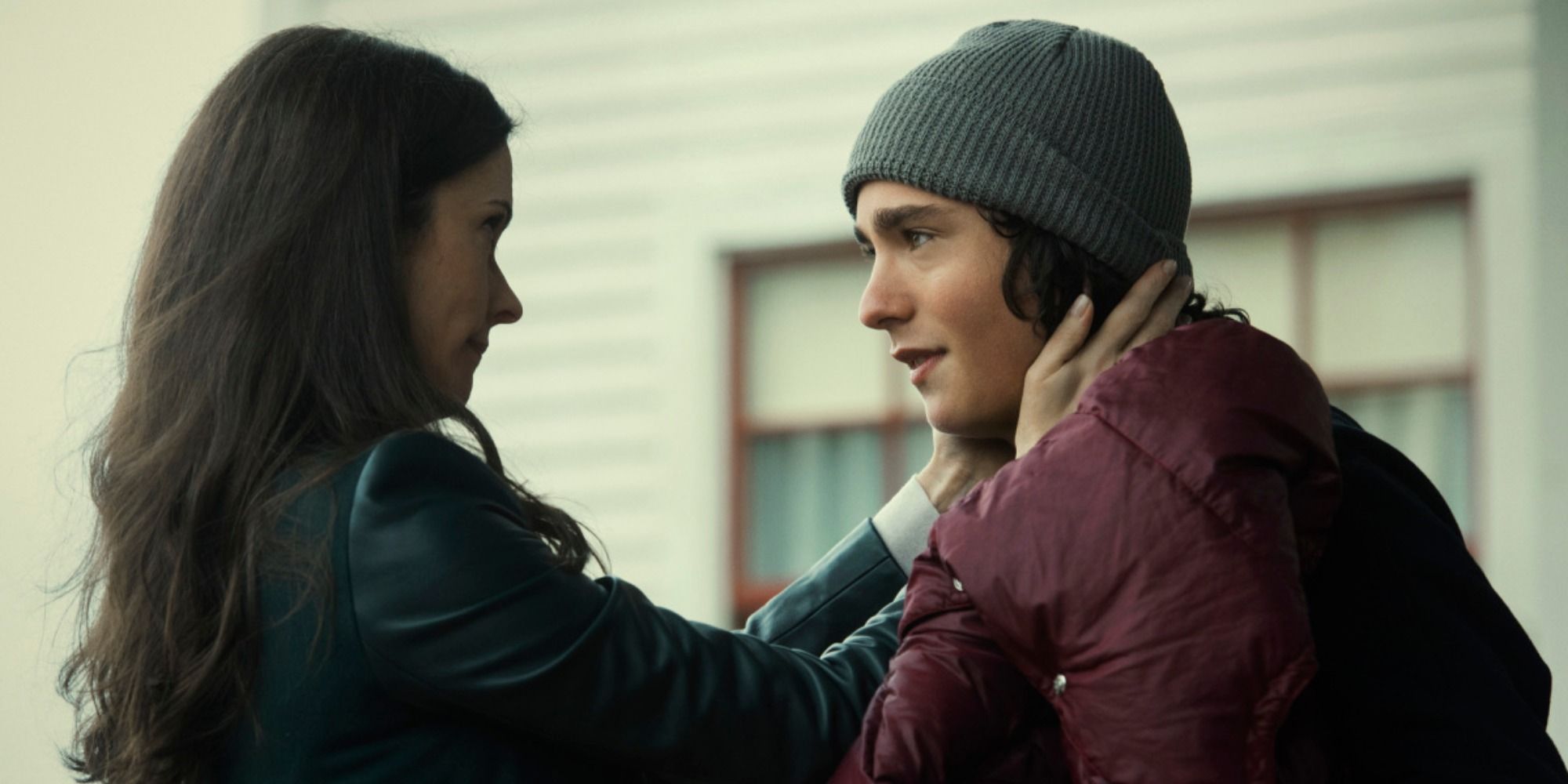 Lois putting her hands on Jordan’s neck.