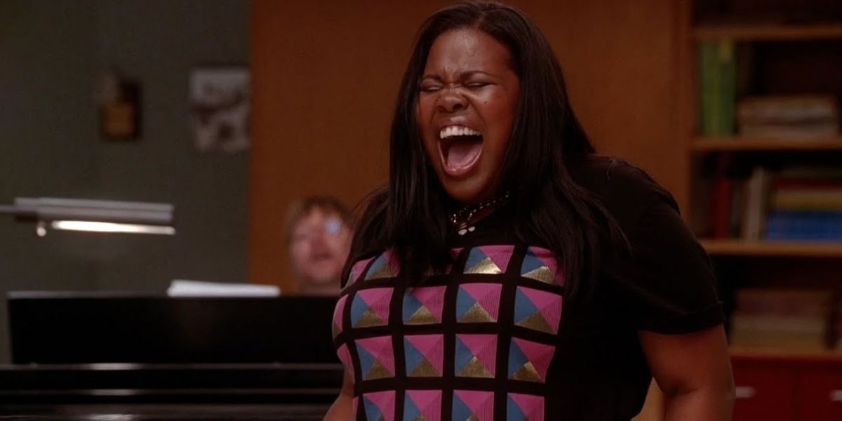 Mercedes singing in the choir room in Glee