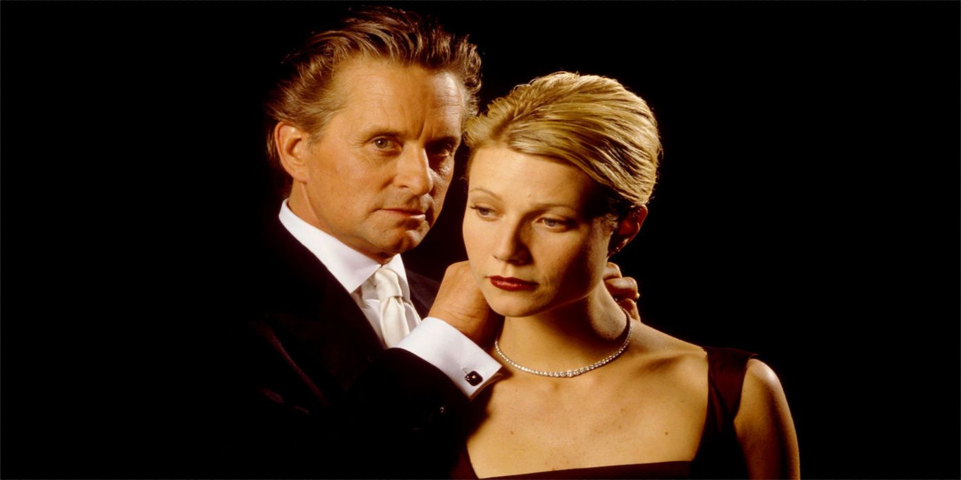 Michael douglas puts a necklace on gwenyth paltrow in a perfect murder