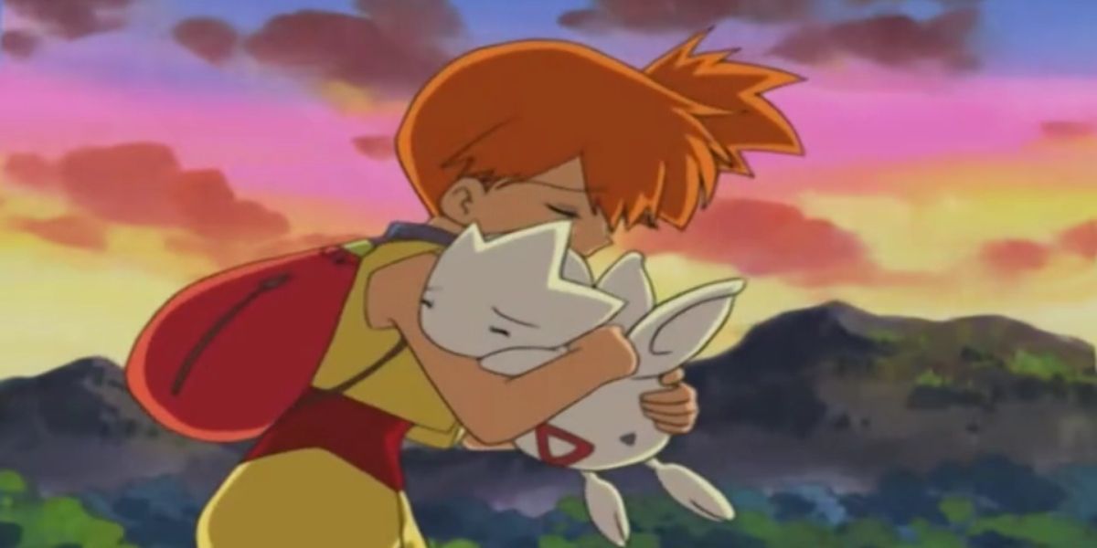 Misty hugs Togetic before she releases him