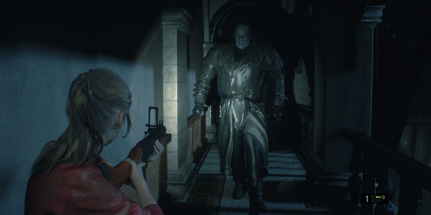 Claire points her gun and flashlight at Mr. X in a dark hallway in Resident Evil 2 Remastered.