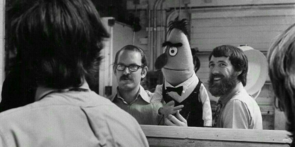Black and white pic of Jim Henson and Bert from Sesame Street.