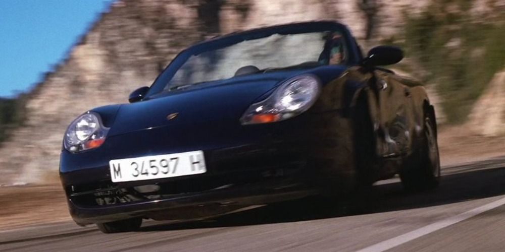 Ethan Hunt chases after Nyah using a Porsche 911
