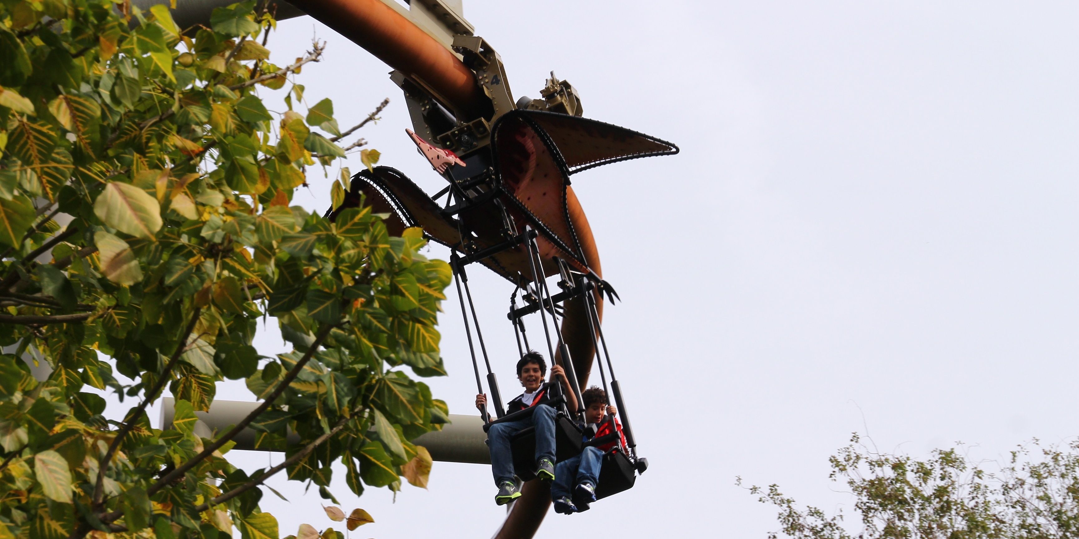 Guests enjoying pteranadon flyers attrraction in Universal Studios Islands Of Adventure