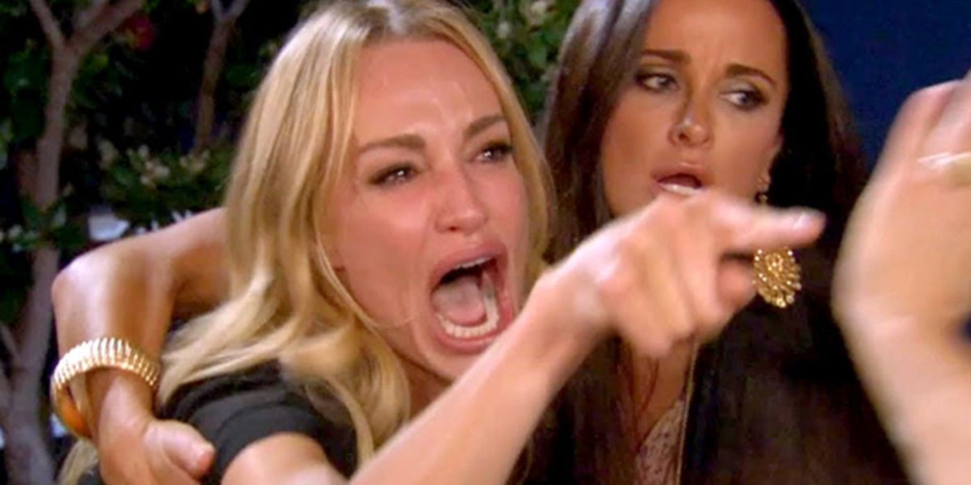 Taylor Armstrong pointing a finger and yelling with Kyle Richards standing next to her on RHOBH