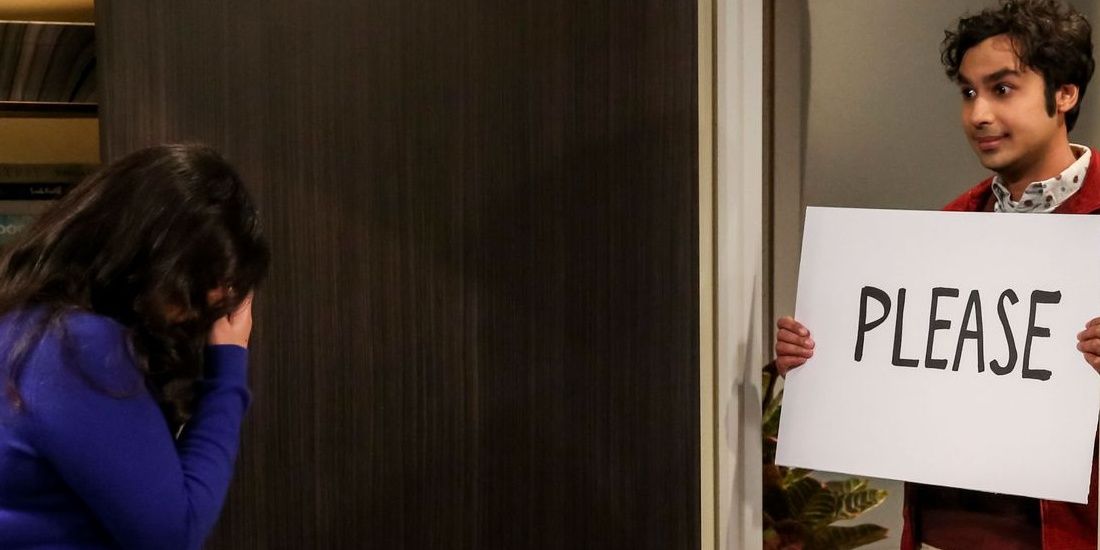 Raj proposes to Annu holding &quot;Please&quot; sign. in The Big Bang Theory