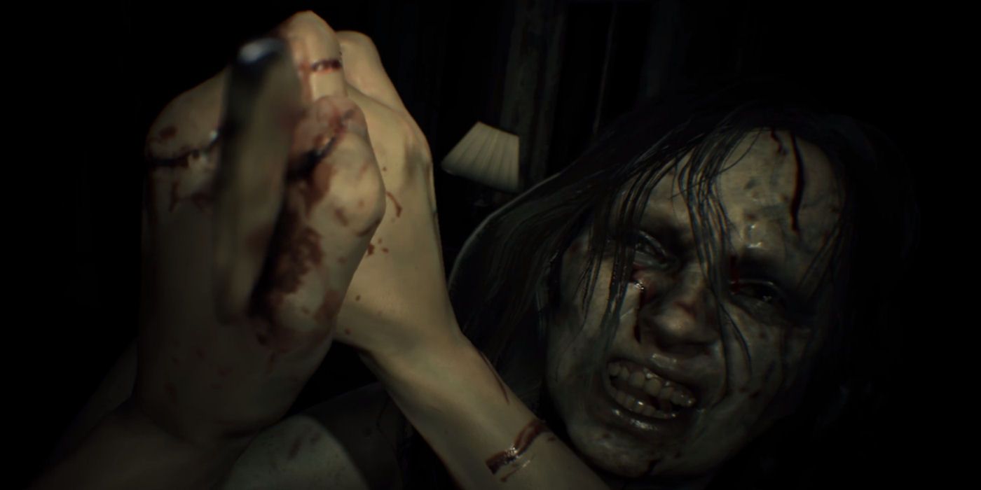 A player struggles with a creature in Resident Evil 7
