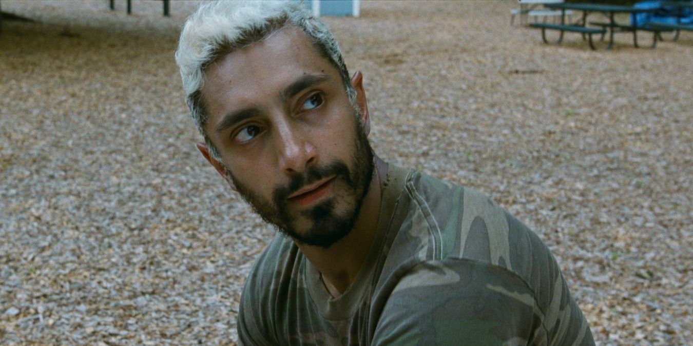 Riz Ahmed as Ruben, sitting in a park in Sound of Metal