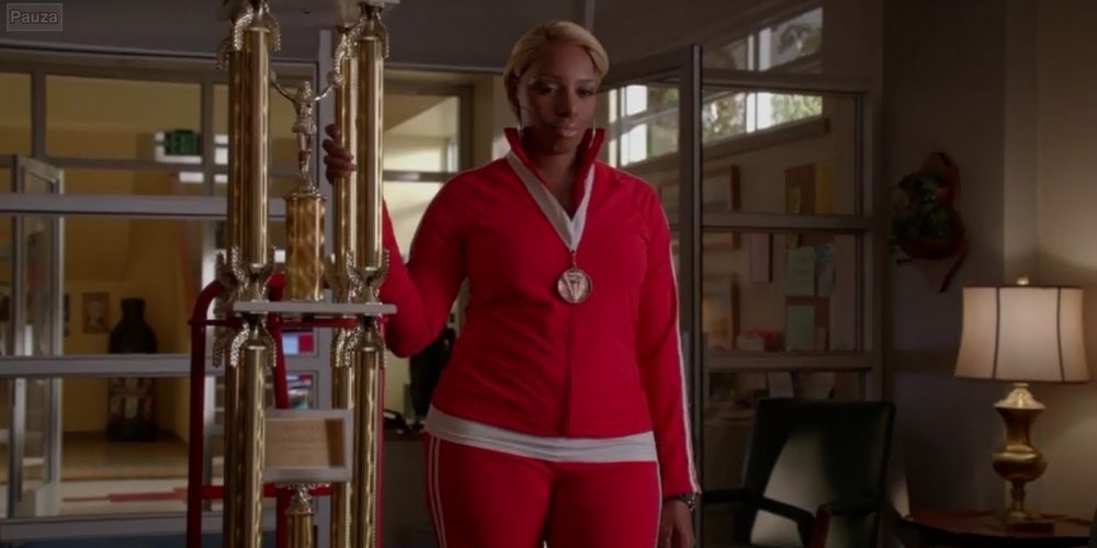 Roz Washington with a trophy in Principal Figgins' office