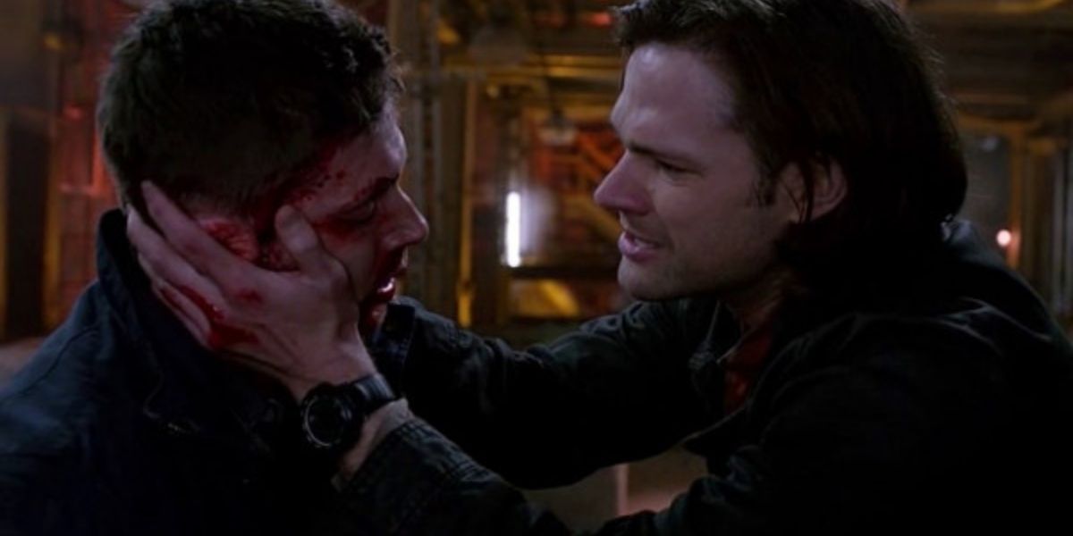 Sam holds Dean's face as he dies