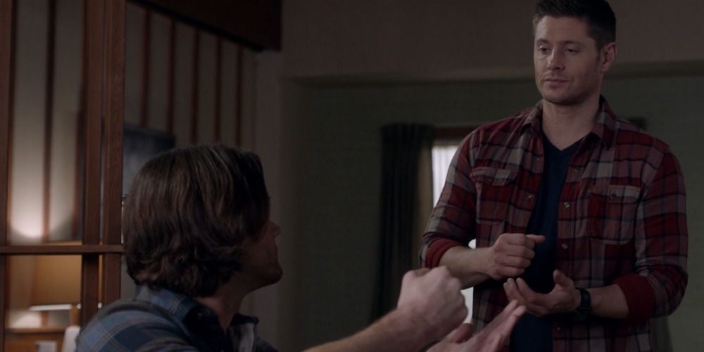 Sam and Dean play rock paper scissors in Supernatural