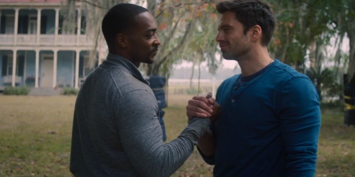 Sam and Bucky embracing hands in he Falcon and The Winter Solder