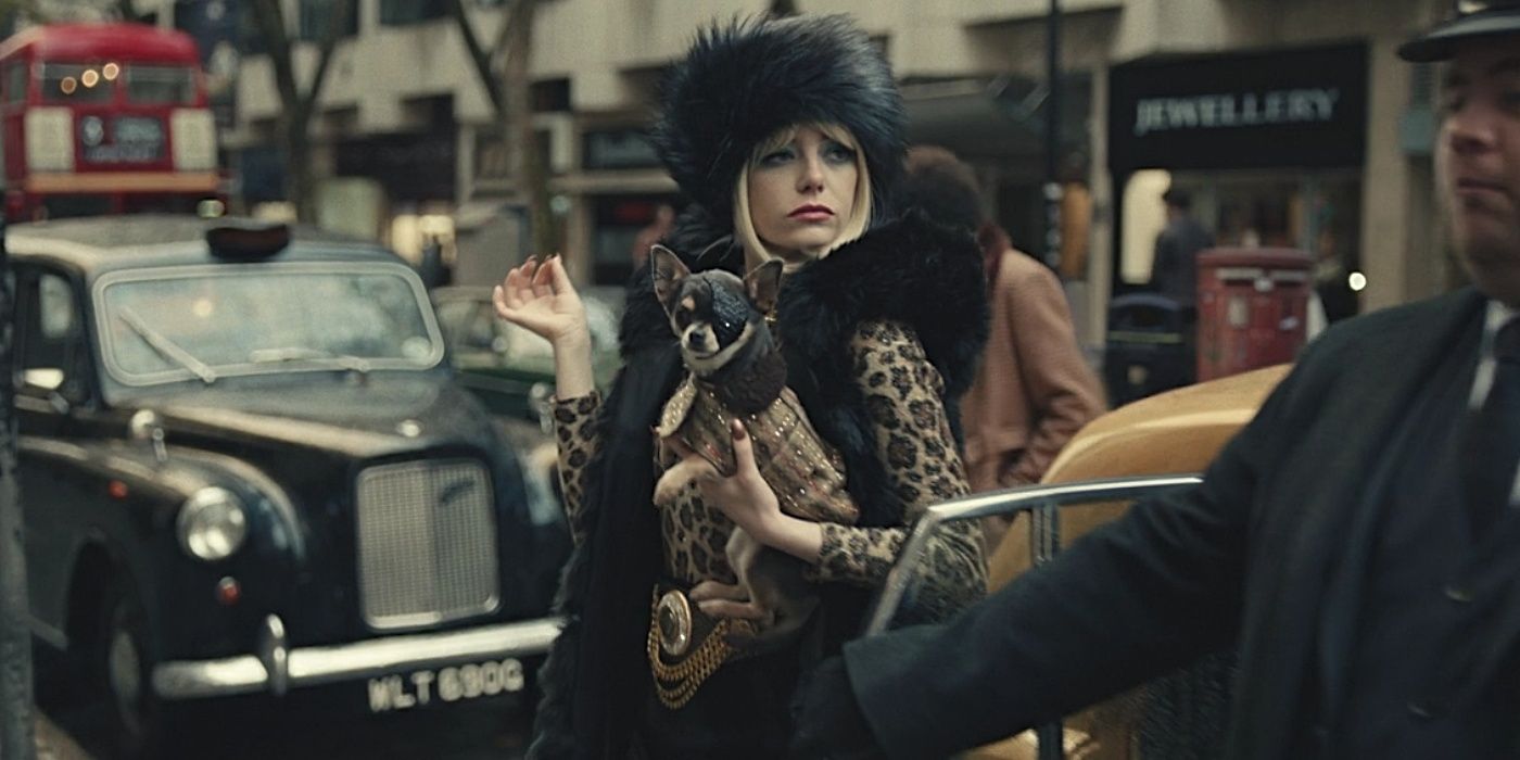 Emma Stone as Estella with Dog Wink in Cruella