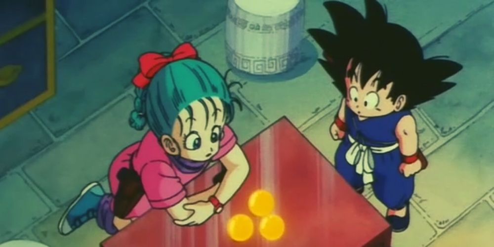 Goku and Bulma staring at Dragon Balls.