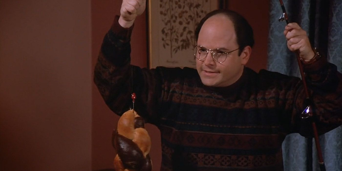 George holding a rye bread attached to a fishing hook in Seinfeld