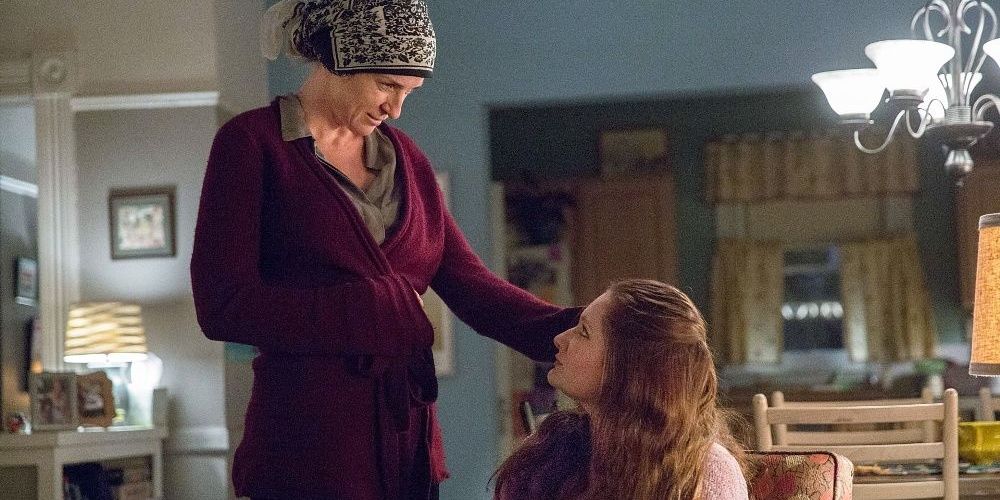 Debbie from Shameless looks up at a cancer patient for whom she's babysitting and cleaning