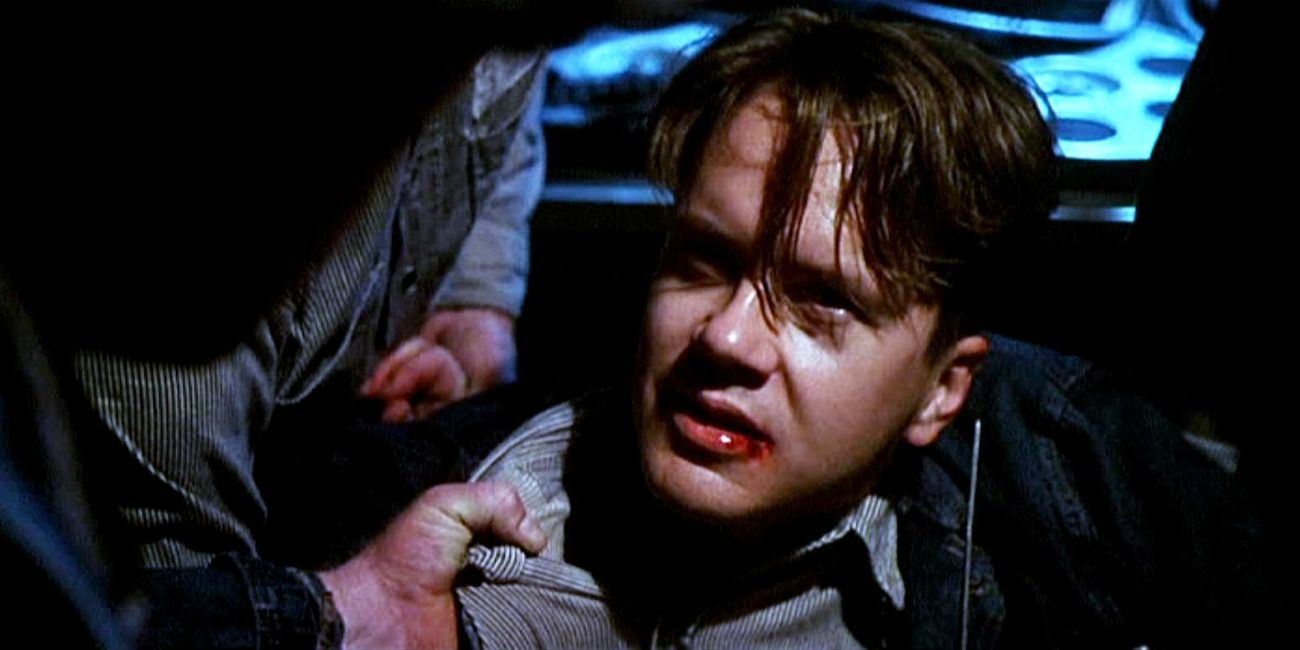 A close up of Andy with a bloody lip in The Shawshank Redemption