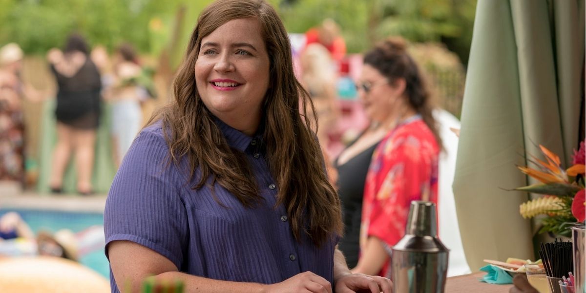 Aidy Bryant wearing a purple dress at the pool bar as Annie on Shrill