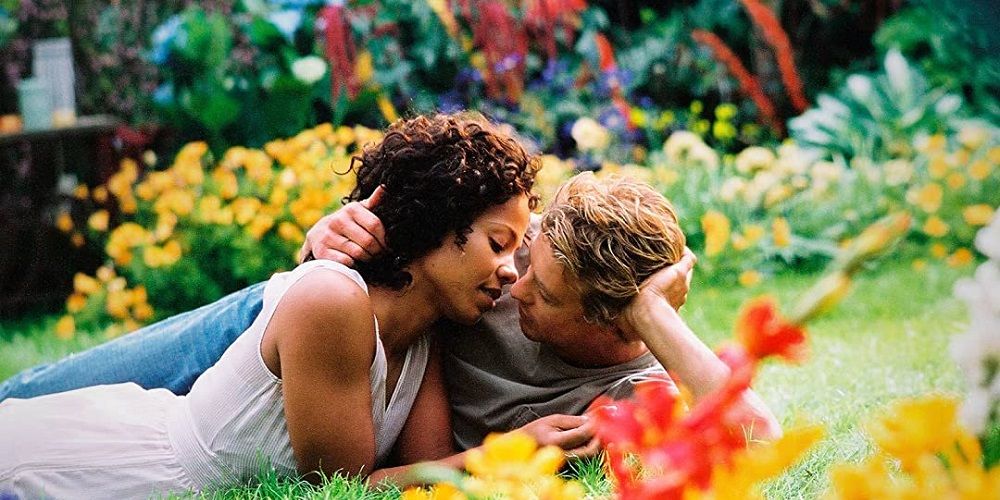 Kenya and Brian kiss in garden in Something New