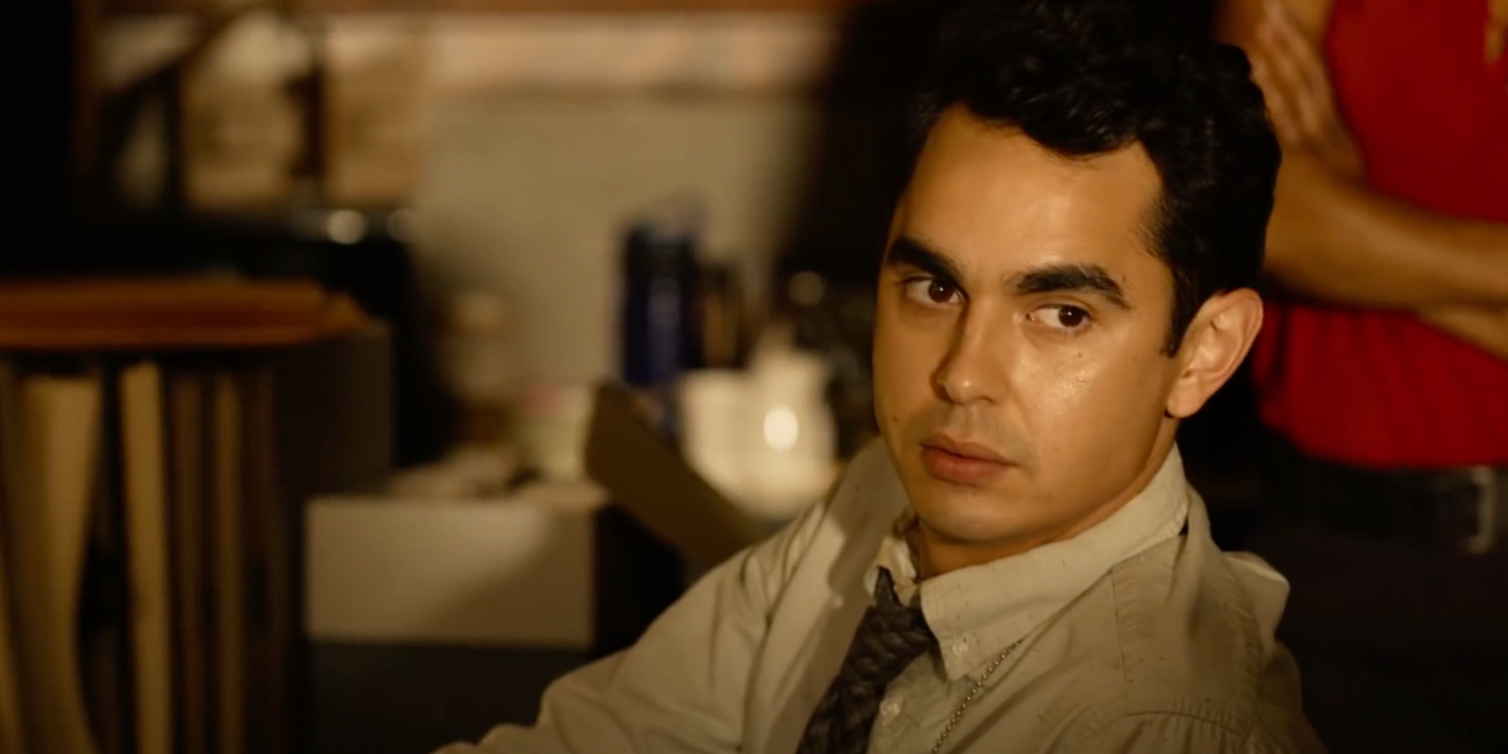 Max Minghella as Detective William Schenk looks to his side in Spiral: From the Book of Saw