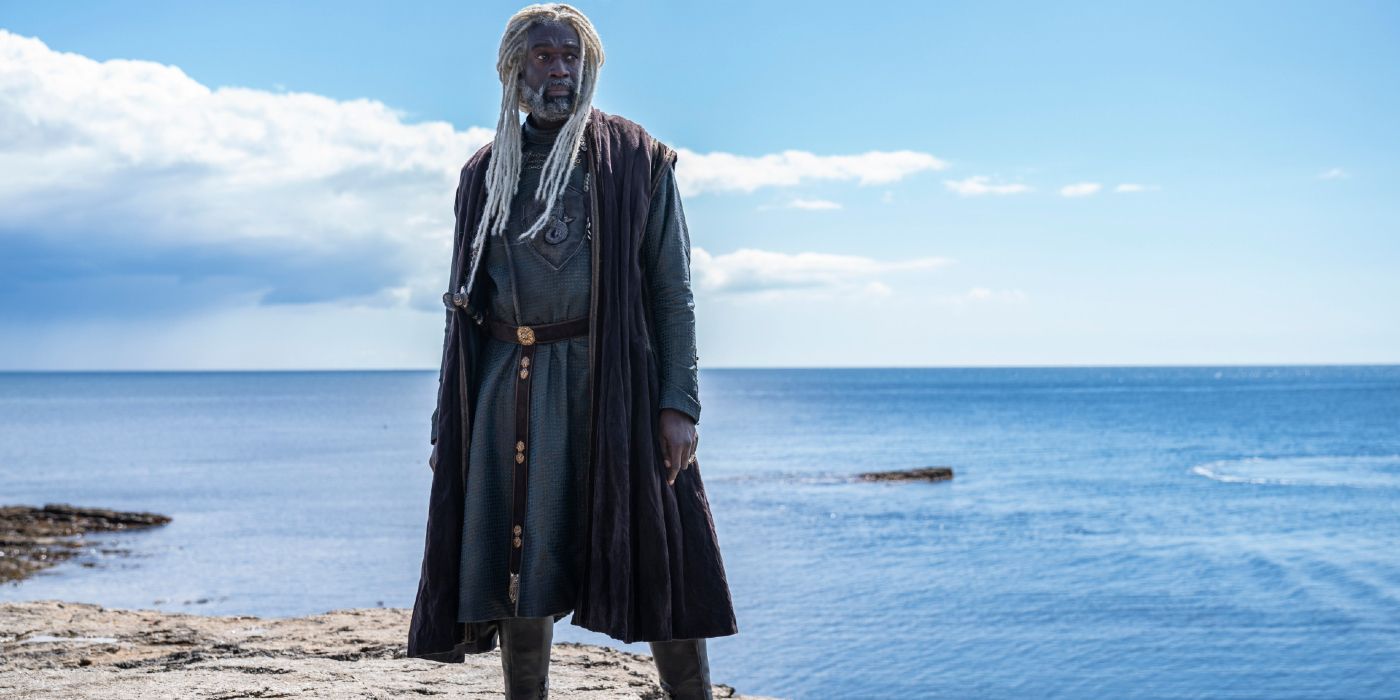 Steve Toussaint as Corlys Velaryon, The Sea Snake, standing proudly on a beach in House of the Dragon