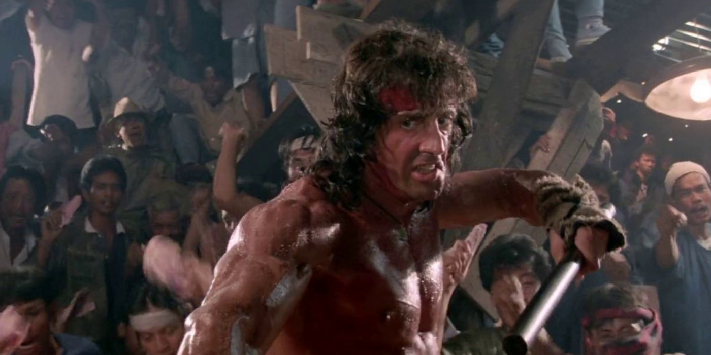 Sylvester Stallone attack with sticks in a still from Rambo III