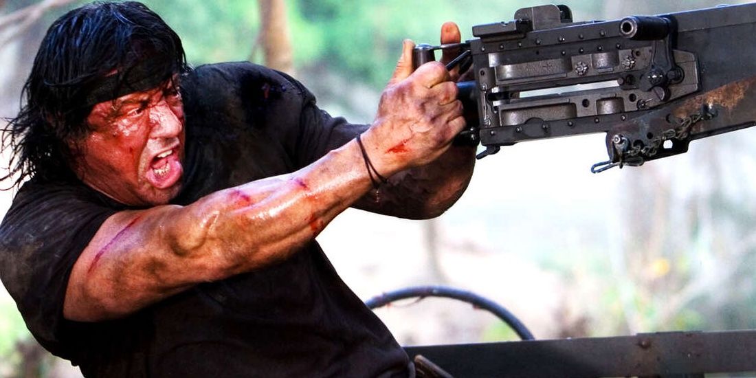 Sylvester Stallone firing a machine gun in a still from John Rambo