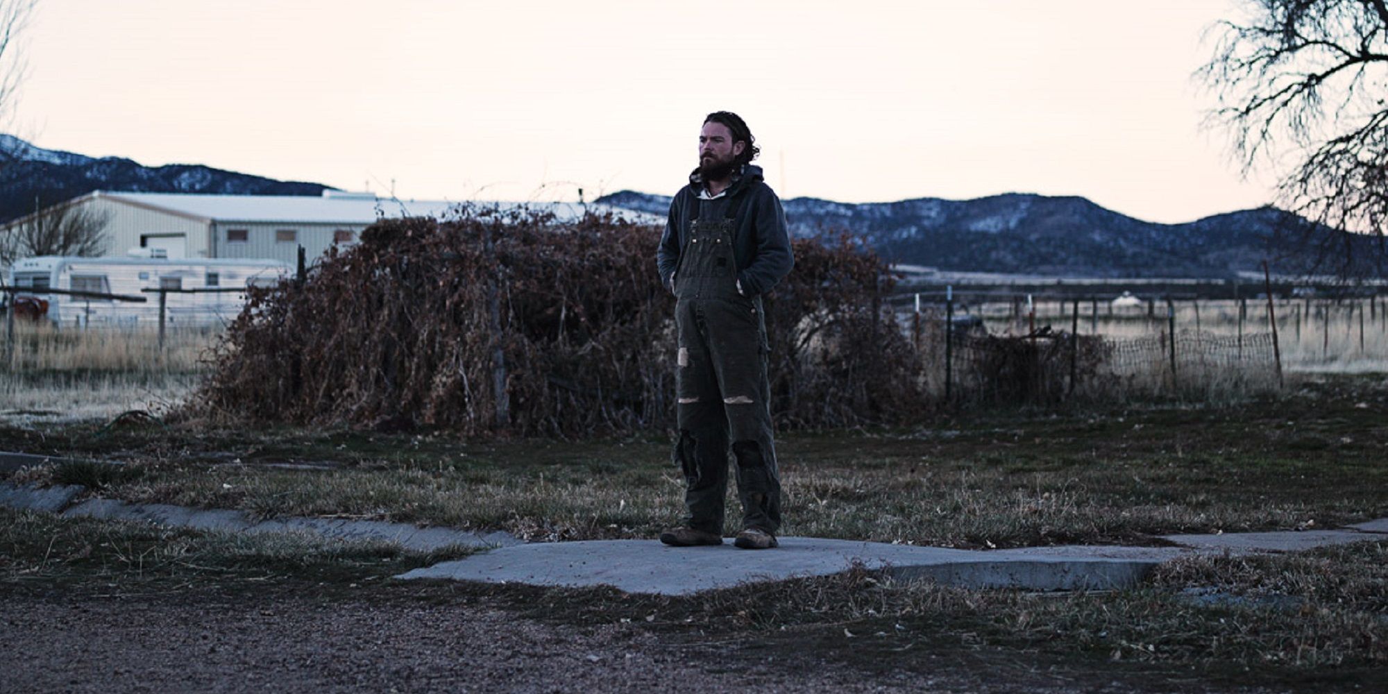 A man standing on the wilderness in The Killing of Two Lovers