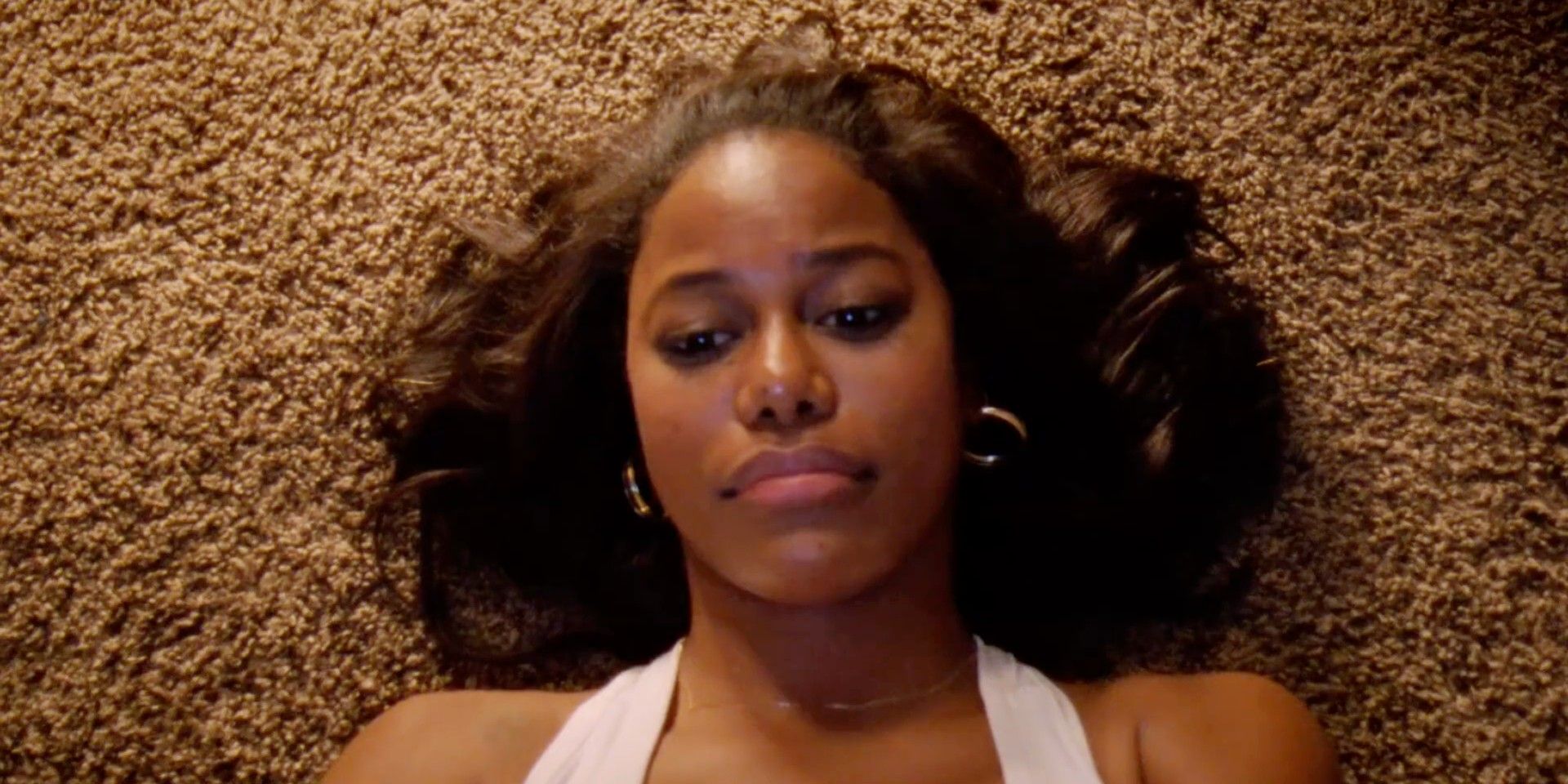 Taylour Paige contemplates her choices in Zola.