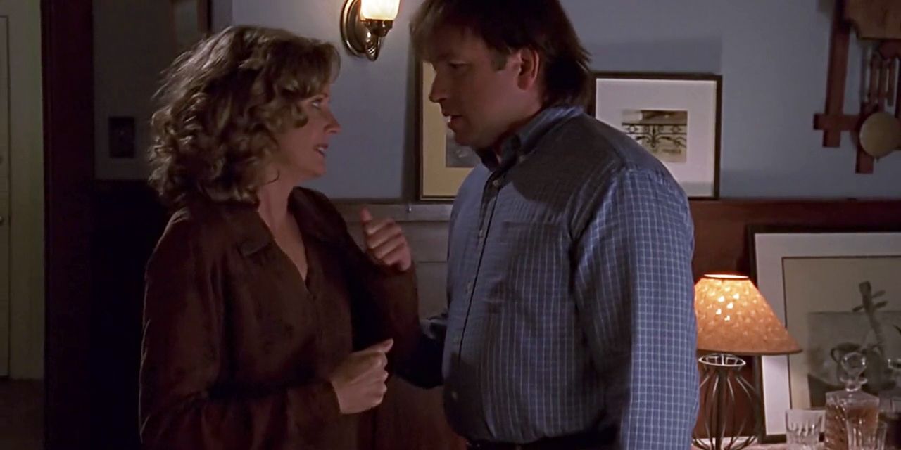 Ted grabs Joyce's arm in Buffy