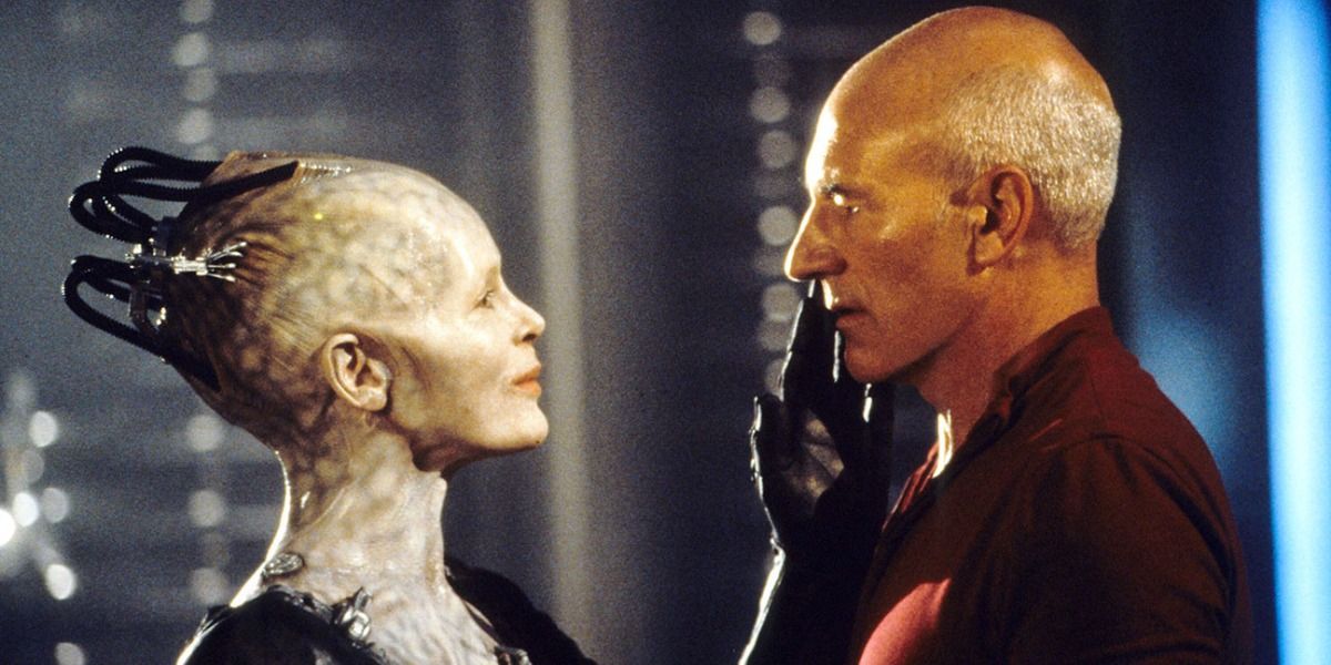 The Borg Queen caresses Picard's face.
