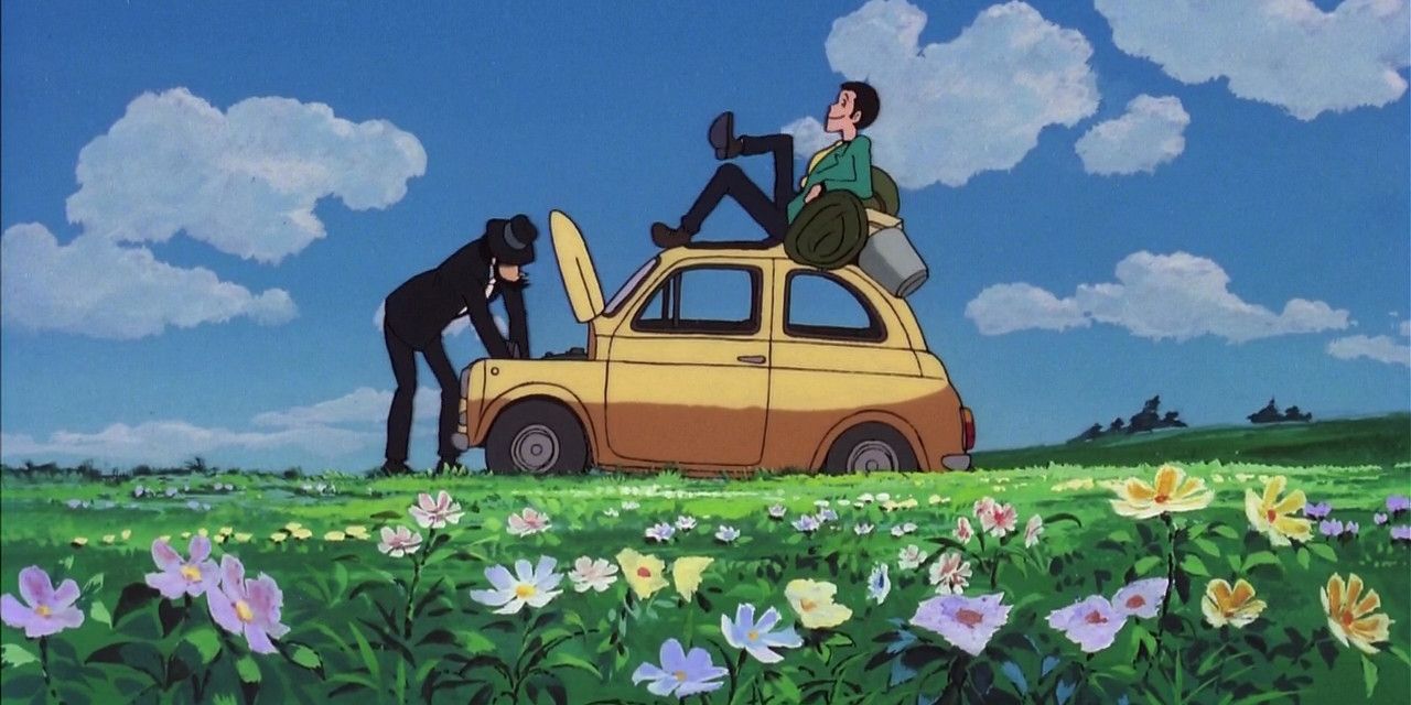 Jigen looks under the hood of a car while Lupin lays on the car's roofin The Castle of Cagliostro.