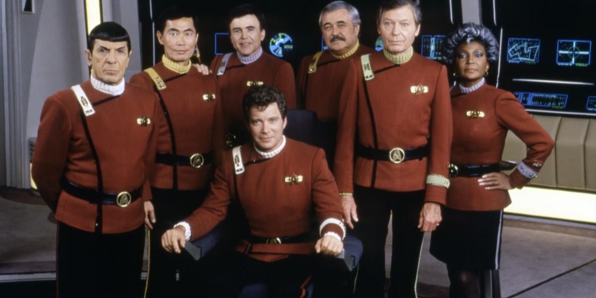 Kirk, Spock, Bones, Uhura, Chekov, Sulu, and Scotty pose for a picture.